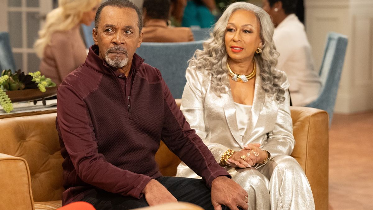 Clifton Davis as Vernon Dupree and Tamara Tunie as Anita Dupree at the country club in Beyond the Gates