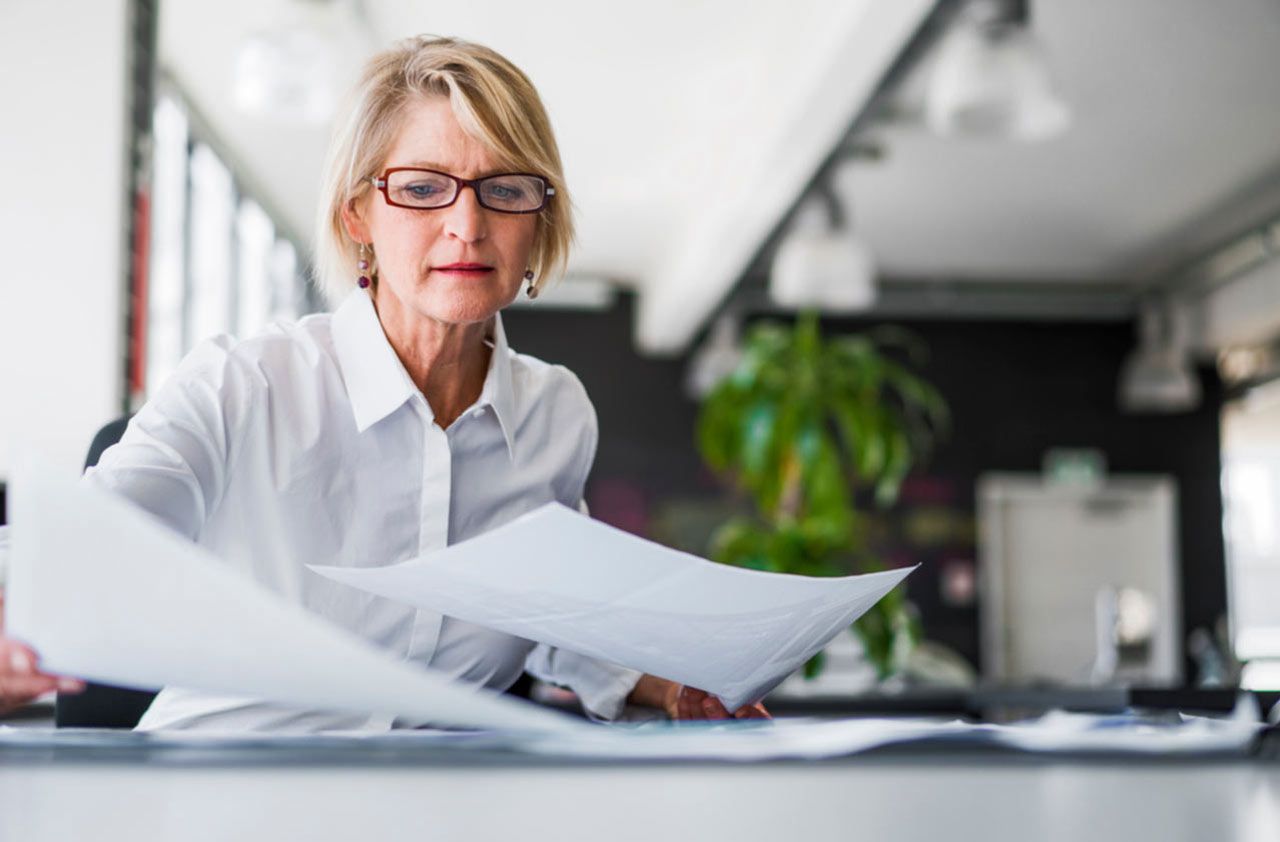 Business woman goes through papers