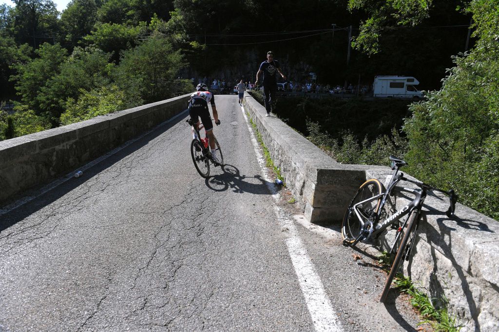 COMO ITALY AUGUST 15 Nicola Conci of Italy and Team Trek Segafredo Specialized bike of Remco Evenepoel of Belgium and Team Deceuninck QuickStep Crash Injury Abandon Medical Doctor during the 114th Il Lombardia 2020 a 231km race from Bergamo to Como ilombardia IlLombardia on August 15 2020 in Como Italy Photo by Tim de WaeleGetty Images