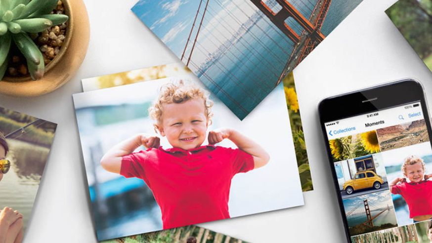 Walmart photo prints and a smartphone