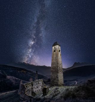 Rruins of the medieval settlement Erzi and milky way appears in back of them in Dzheyrakhsky district, Ingushetia, Russia on November 5, 2021. (Photo by Natalia Zakharova/Anadolu Agency via Getty Images)