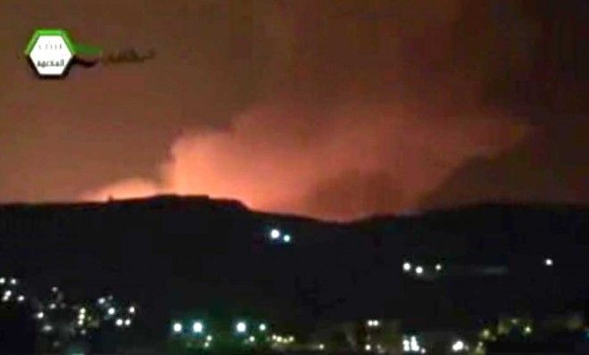 Smoke and fire fill the the skyline over Damascus, Syria, early Sunday, May 5, 2013 after an Israeli airstrike. Israeli warplanes struck areas in and around the Syrian capital Sunday, setting