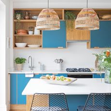 Blue kitchen with rattan shades