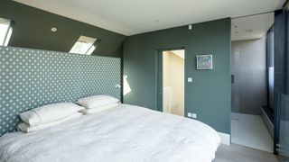 green bedroom in a loft conversion