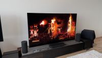 The Sony Bravia 9 II TV and Bravia Theatre Trio speaker system, photographed on a low AV stand