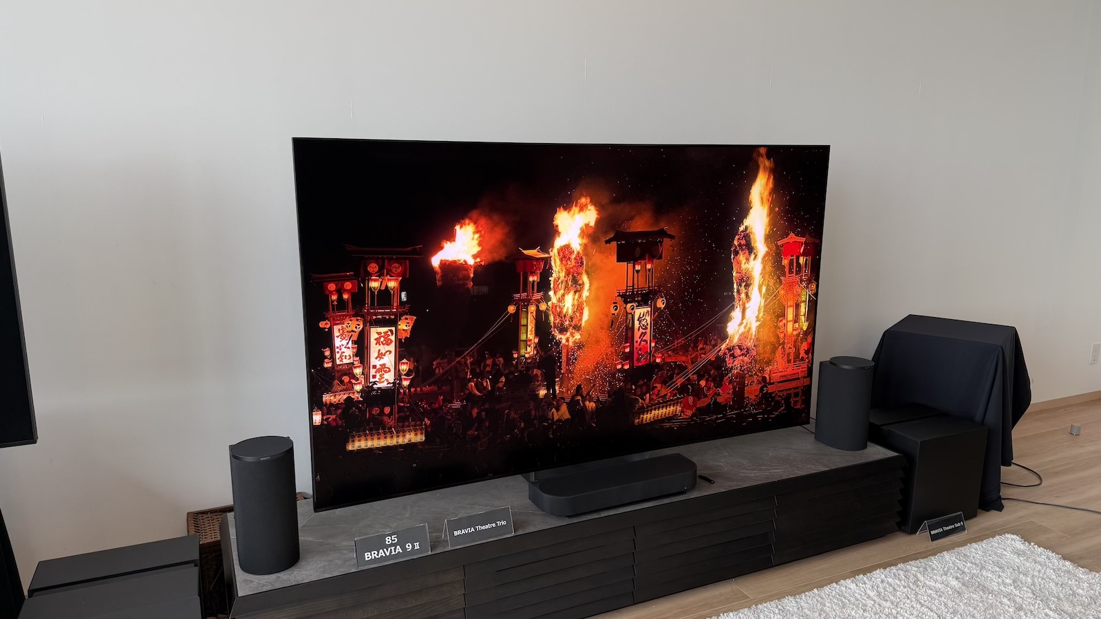 The Sony Bravia 9 II TV and Bravia Theatre Trio speaker system, photographed on a low AV stand