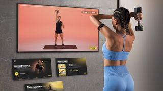 Woman working out in front of Samsung TV with TechnoGym app