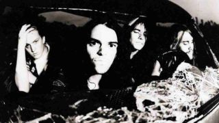 Kyuss posing for a photograph in a car in 1991