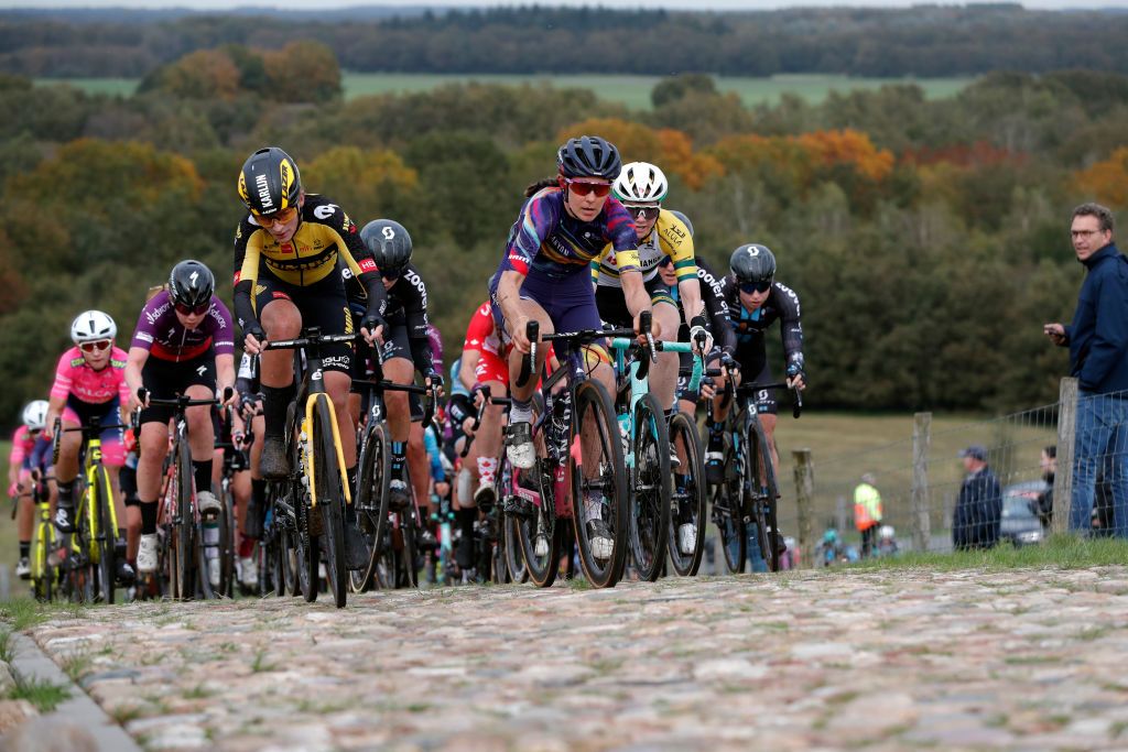 HOOGEVEEN NETHERLANDS OCTOBER 23 LR Karlijn Swinkels of Netherlands and Team Jumbo Visma Elise Chabbey of Switzerland and Team Canyon SRAM Racing Sarah Roy of Australia and Team BikeExchange and the peloton compete through cobblestones sector during the 17th UCI Womens WorldTour Ronde van Drenthe 2021 a 1591km one day race from Assen to Hoogeveen UCIWWT RondevDrenthe on October 23 2021 in Hoogeveen Netherlands Photo by Bas CzerwinskiGetty Images