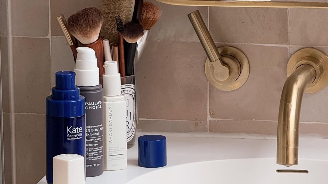 Photo of skincare products on a bathroom sink 