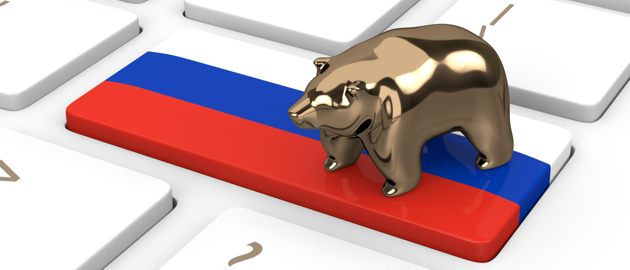 A Russian Flag over a keyboard with a golden bear