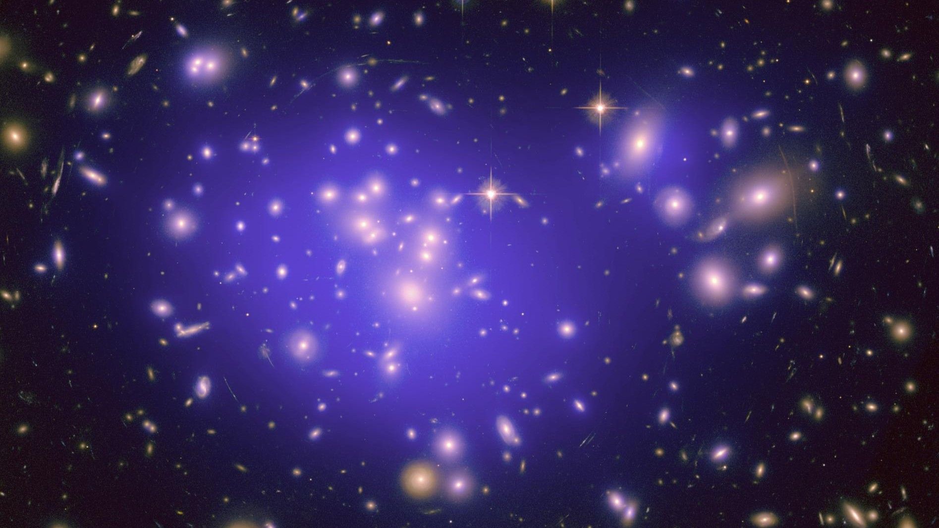 Photo: Livescience A galaxy with a large reservoir of dark matter (purple overlay) in its center