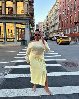 Woman wearing yellow long skirt.