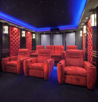 bespoke cinema room with red seating from Loud & Clear