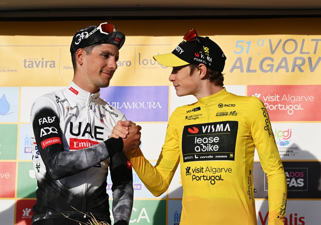 MALHAO PORTUGAL FEBRUARY 23 LR Joao Almeida of Portugal and UAE Team Emirates XRG on second place and race winner Jonas Vingegaard of Denmark and Team Visma Lease a Bike Yellow leader jersey on the podium ceremony after the 51st Volta ao Algarve em Bicicleta Stage 5 a 196 individual time trial stage from Salir to Malhao 477m on February 23 2025 in Malhao Portugal Photo by Tim de WaeleGetty Images