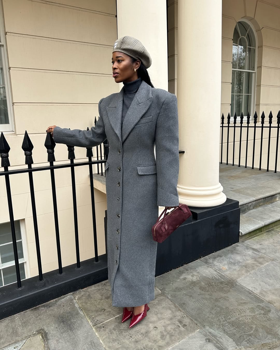 @nlmarilyn carries an Ala&amp;iuml;a top-handle bag