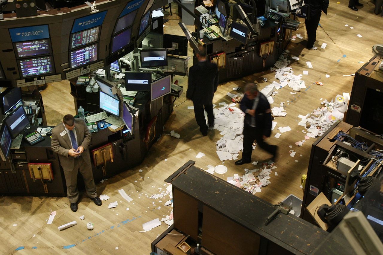 Stock brokers walk around a destroyed exchange floor after the 2008 economic crisis