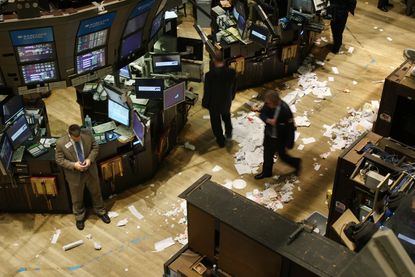 Stock brokers walk around a destroyed exchange floor after the 2008 economic crisis