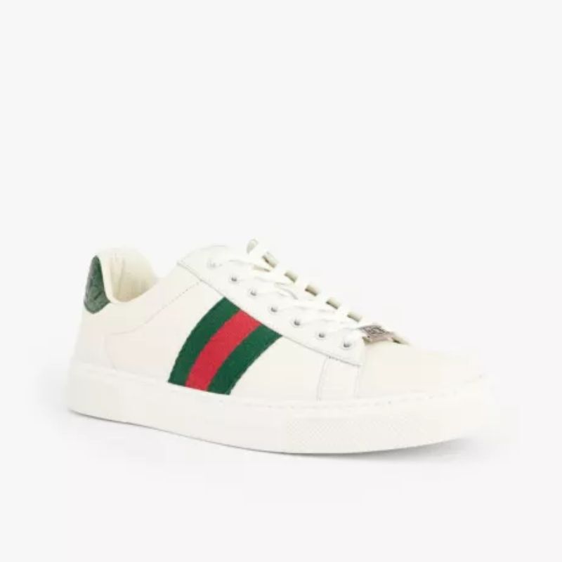 white trainers low cut with green and red stripes