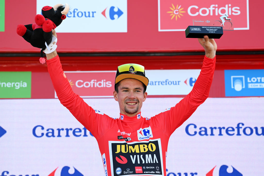 ALTO DE LA MONTAA DE CULLERA SPAIN AUGUST 19 Primoz Roglic of Slovenia and Team Jumbo Visma celebrates winning the Red Leader Jersey on the podium ceremony after the 76th Tour of Spain 2021 Stage 6 a 1583km stage from Requena to Alto de la Montaa de Cullera 184m lavuelta LaVuelta21 on August 19 2021 in Alto de la Montaa de Cullera Spain Photo by Stuart FranklinGetty Images
