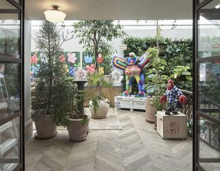 busy planting in internal terrace at Maison Colbert in London