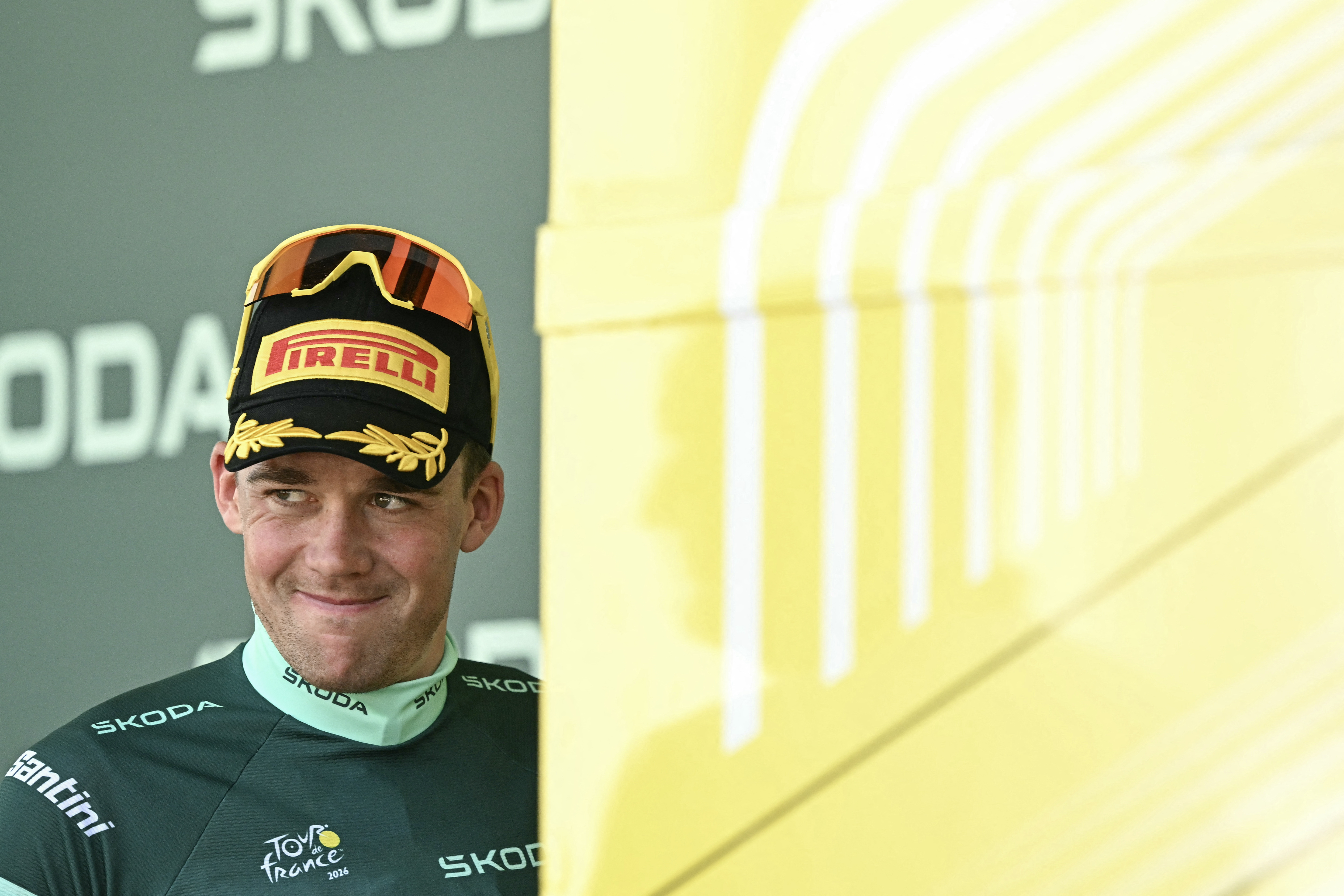 Lidl - Trek's Mads Pedersen celebrates on the podium with the best sprinter's green jersey after the 9th stage of the 113th edition of the Tour de France (Photo by Loic VENANCE / AFP)