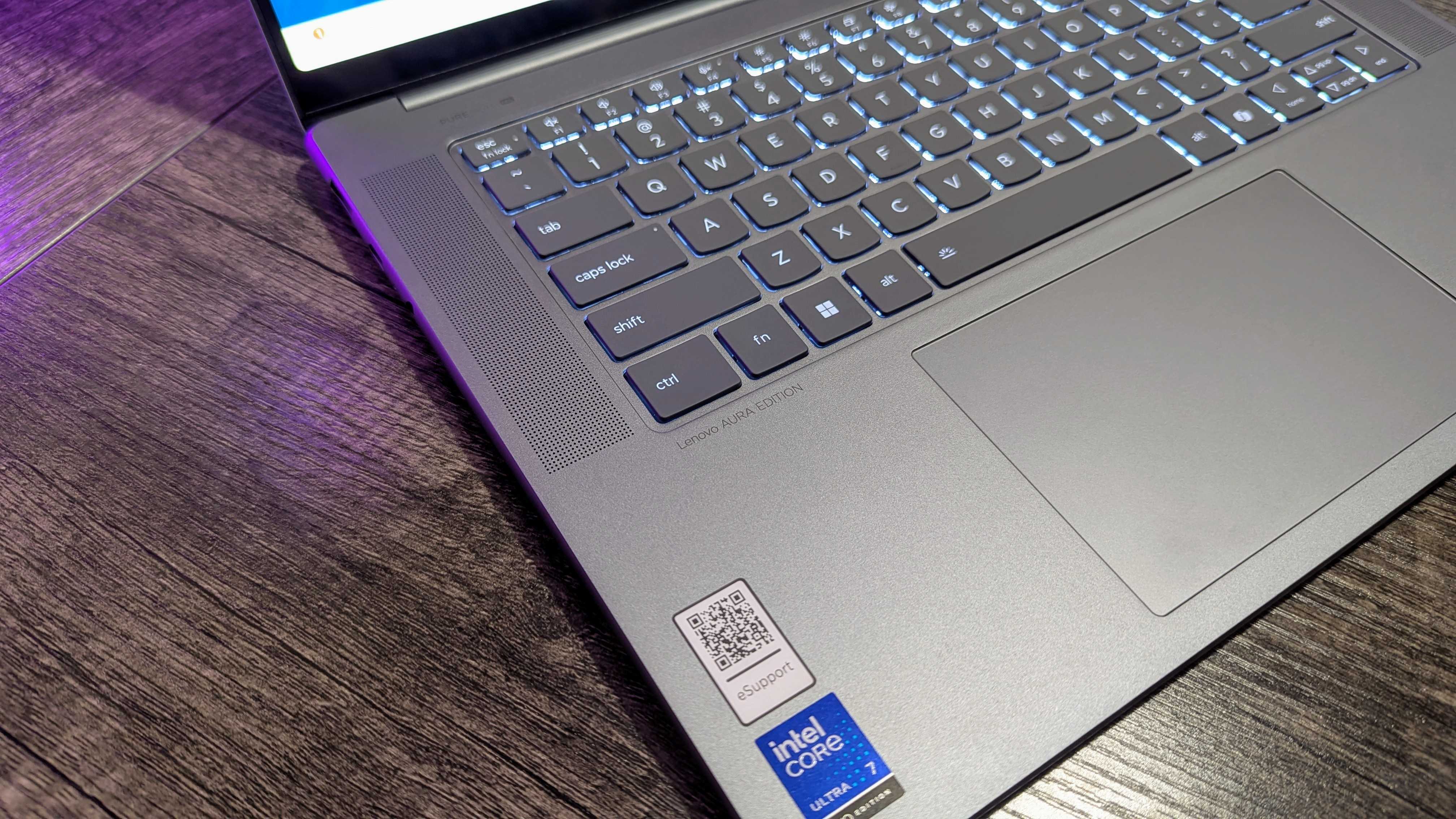 The Lenovo Yoga Slim 7i (Gen 9) Aura Edition's keyboard, focusing on the Lenovo Aura Edition branding.