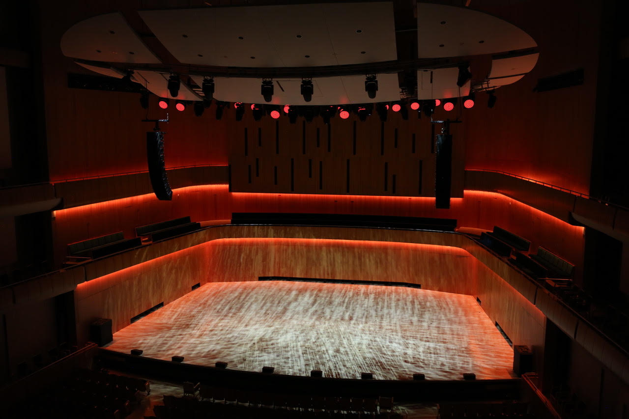 The Holland Center in Omaha alit in blue and red by Ayrton lighting solutions.