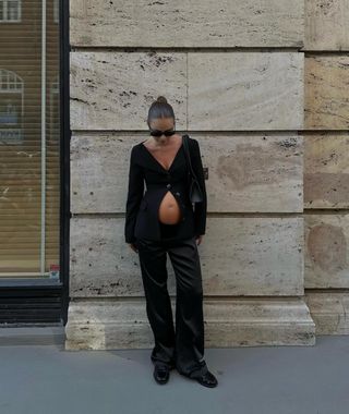 Maria Kragmann wearing a black cardigan and black pants