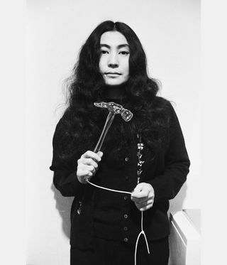 Yoko Ono with hammer
