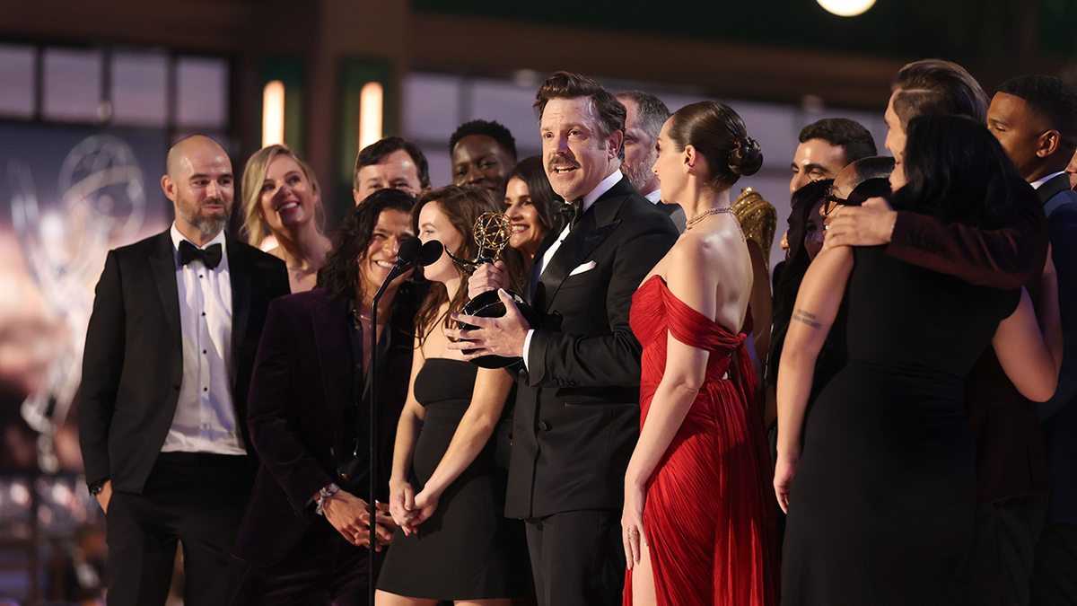 Jason Sudeikis and cast and crew accept the Outstanding Comedy Series award for &quot;Ted Lasso&quot; on stage during the 74th Annual Primetime Emmy Awards