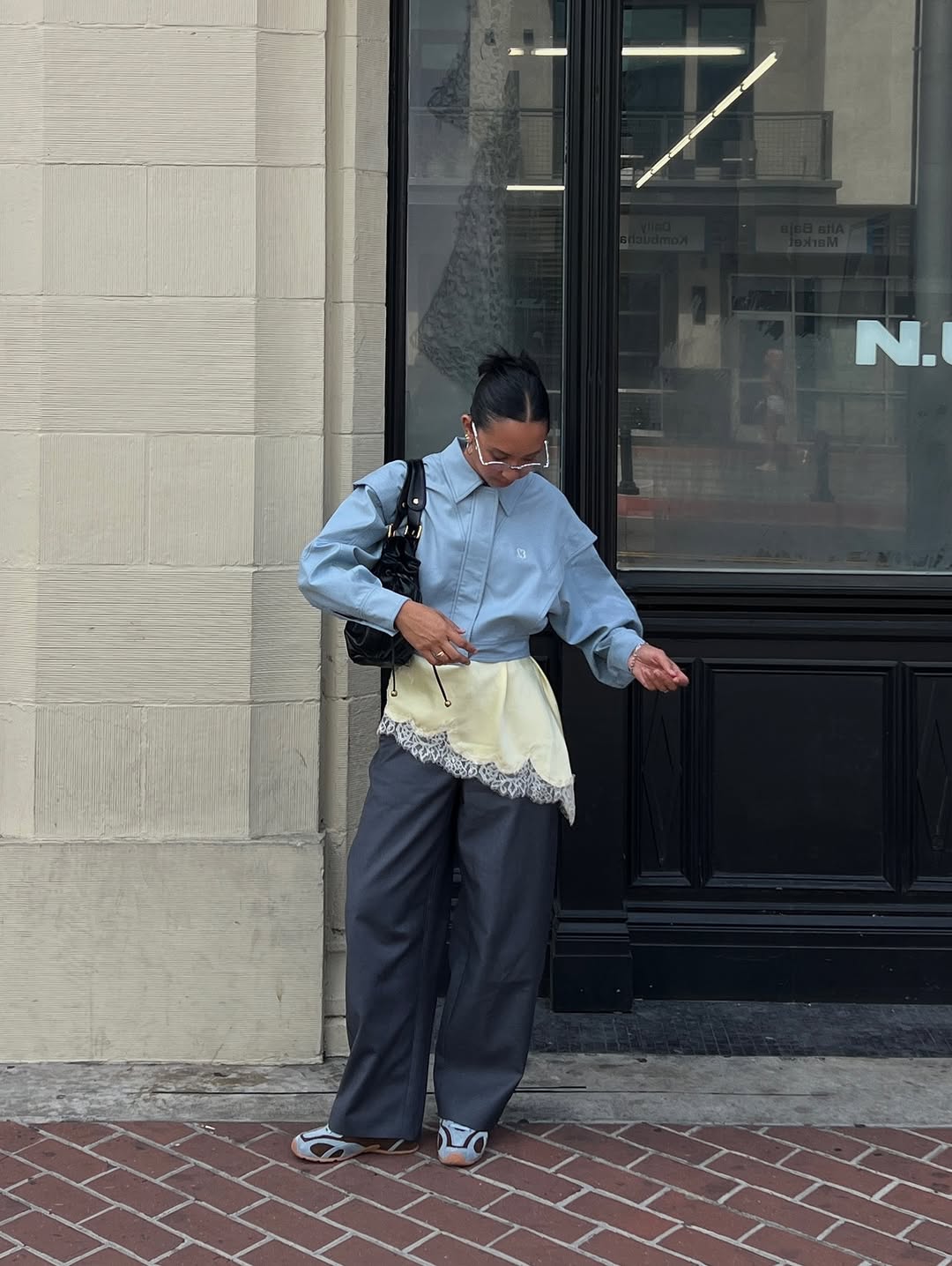 woman wearing winter sneaker outfit 2025