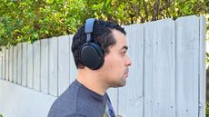 Listing image for best over-ear headphones showing best value Sennheiser Accentum worn by reviewer
