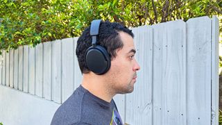 Listing image for best over-ear headphones showing best value Sennheiser Accentum worn by reviewer