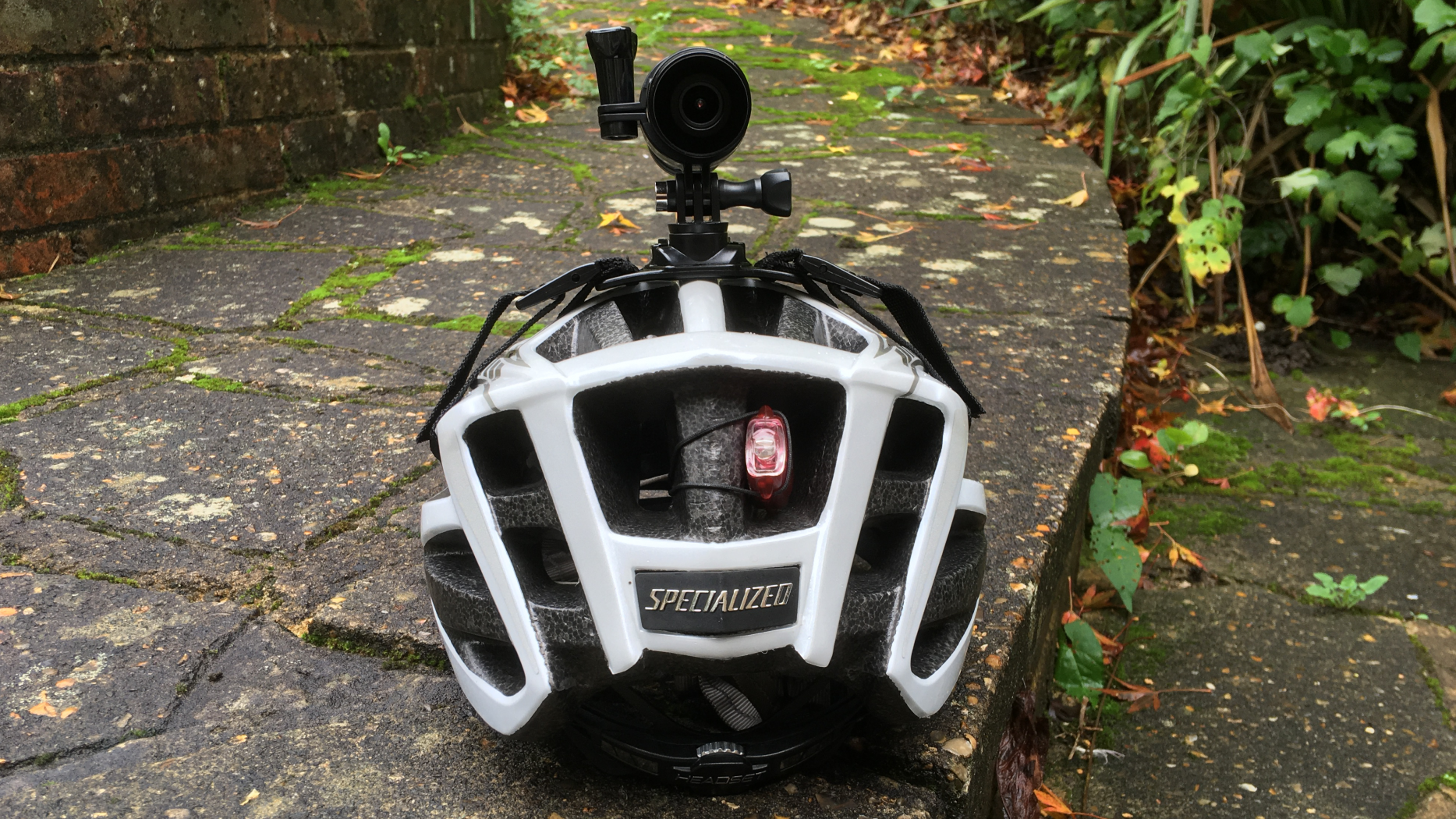 Image shows the Techalogic DC-1 mounted on a bike helmet