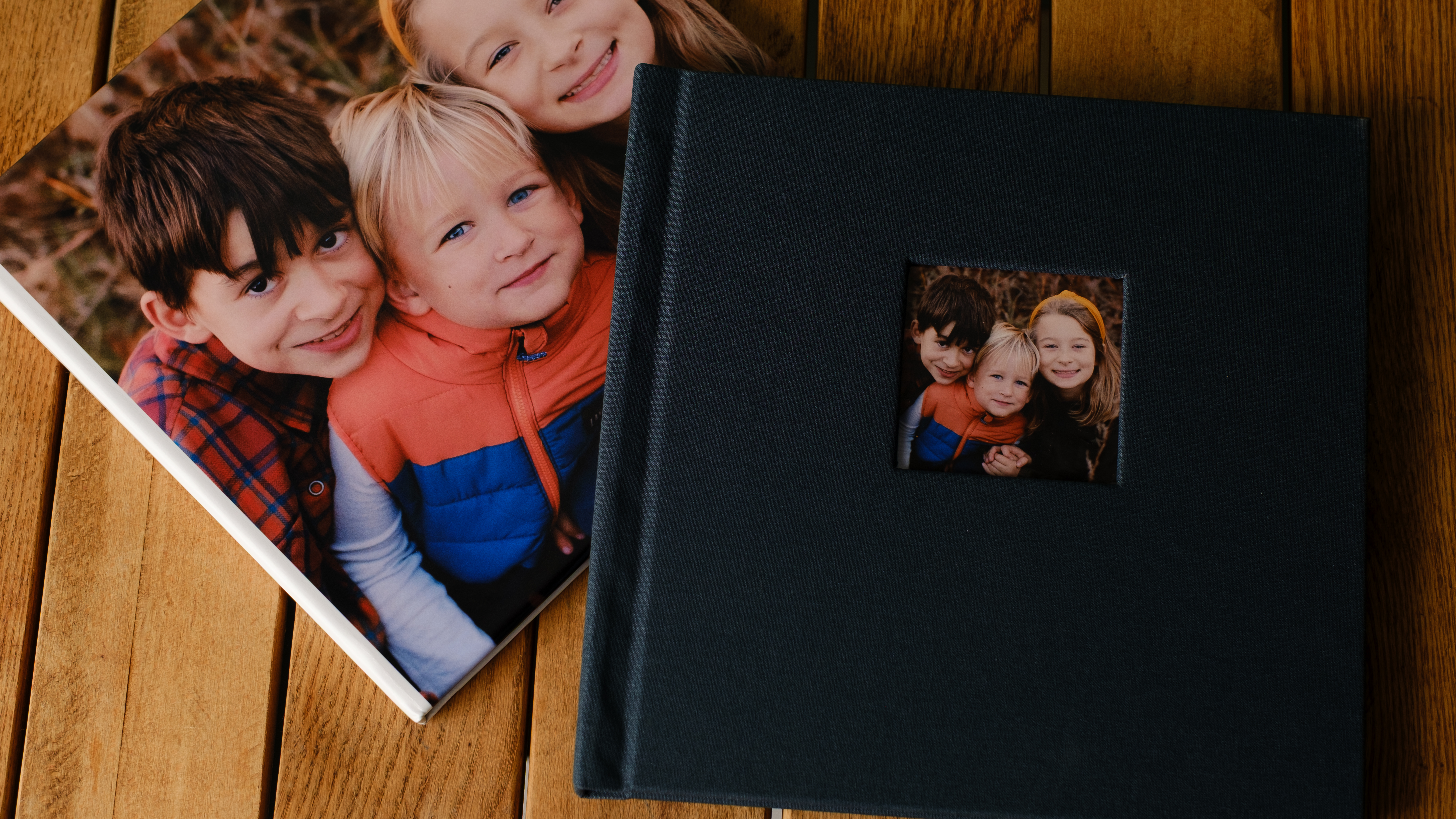Photo books from Printique on a desktop