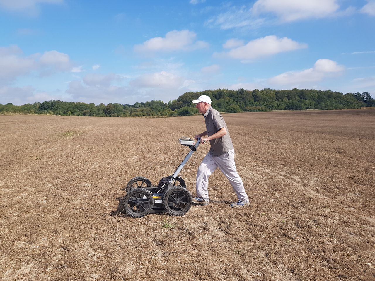 Archaeologist and study lead researcher Chris Gaffney uses ground penetrating radar to find the Neolithic pits.