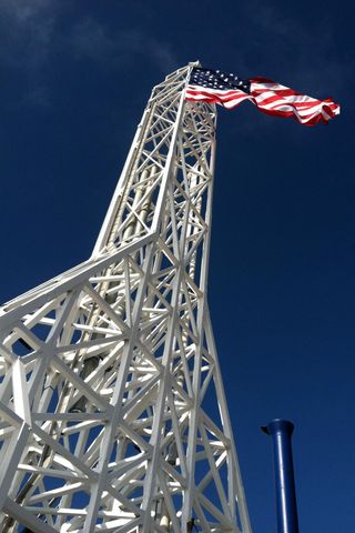 An American flies from the top of SpaceX's Falcon 9 rocket support structure at Vandenberg Air Force Base in California on Sept. 11, 2013.