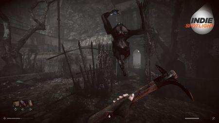 Total Chaos screenshot of a creature springing up in the air towards the protagonist, who wields a wrench in a dark, wooded area. The Indie Spotlight logo can be seen in the top right-hand corner of the image