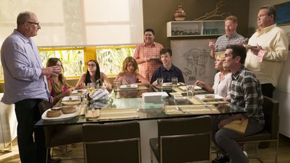 The cast of the TV show Modern Family in a scene.
