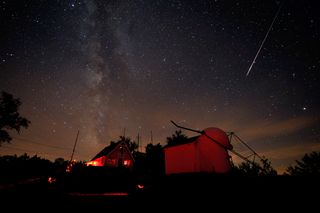 A bright Perseid meteor streaks over the Stellafane observatory in Springfield, Vermont on Aug. 7, 2010 during the Perseid meteor shower.