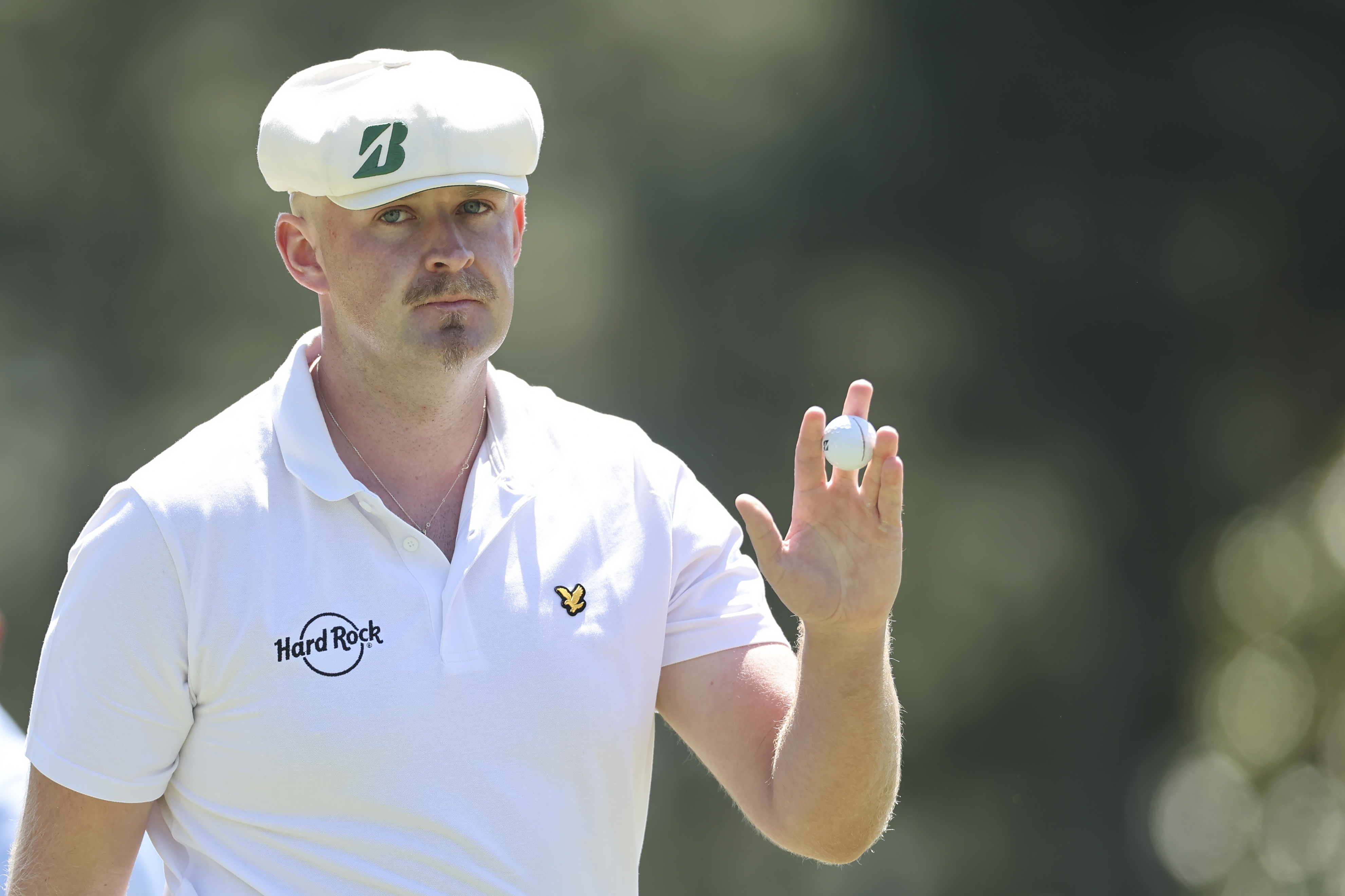 Harry Hall reacts on the first green during the first round of the 2026 Masters Tournament at Augusta National Golf Club