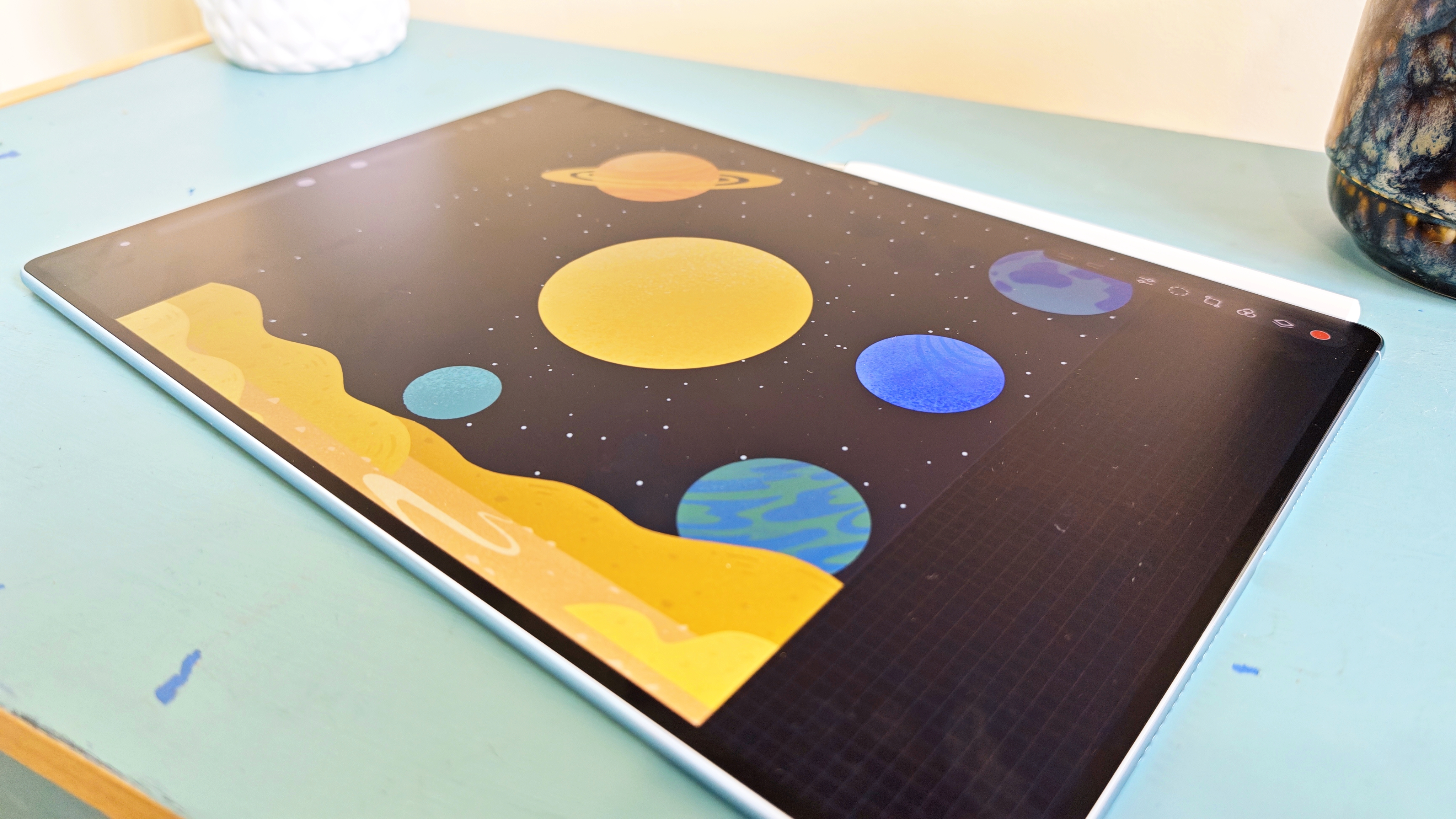 A Huawei MatePad Pro Max tablet on a blue-green table
