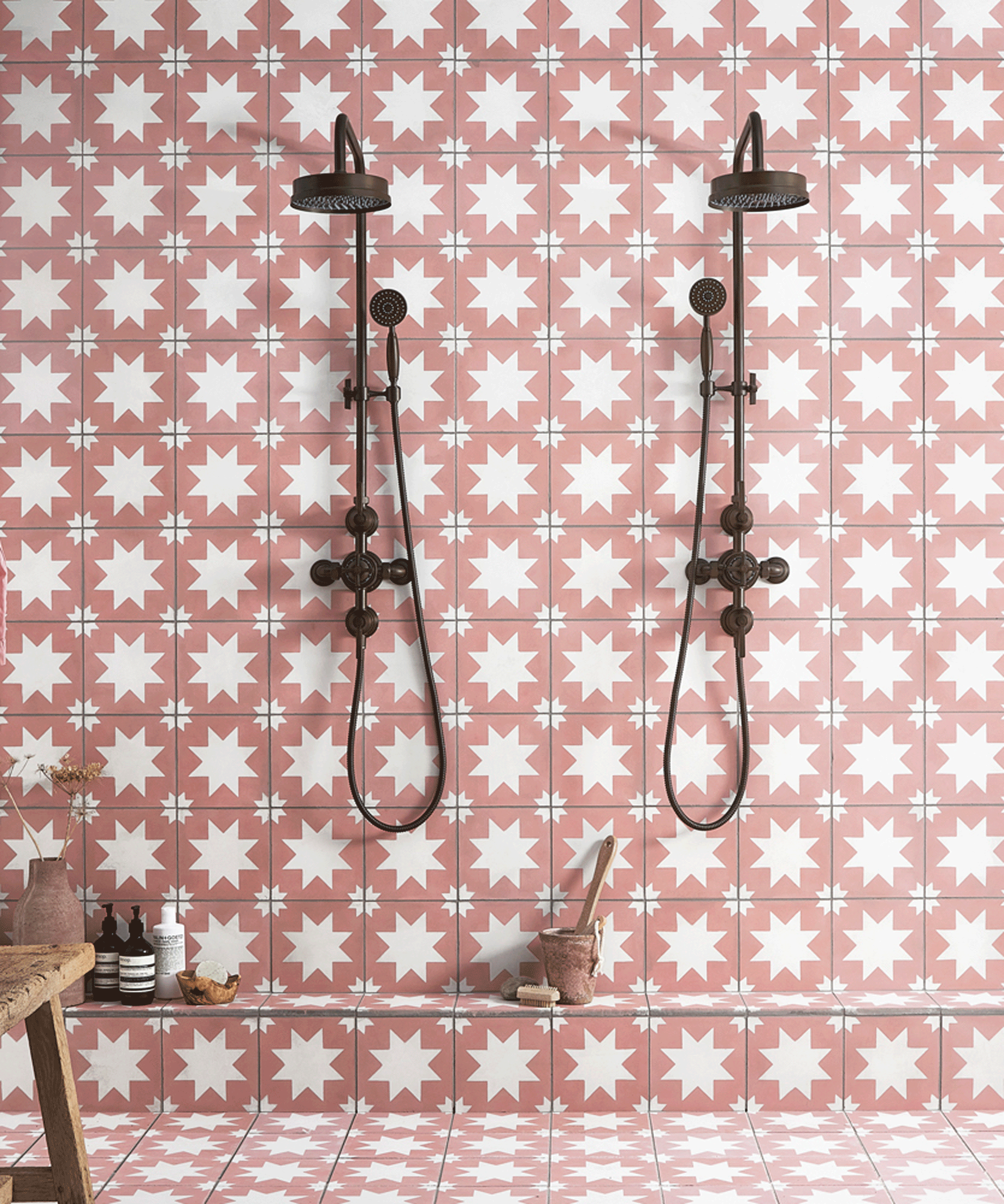 Patterned pink tiles on shower wall