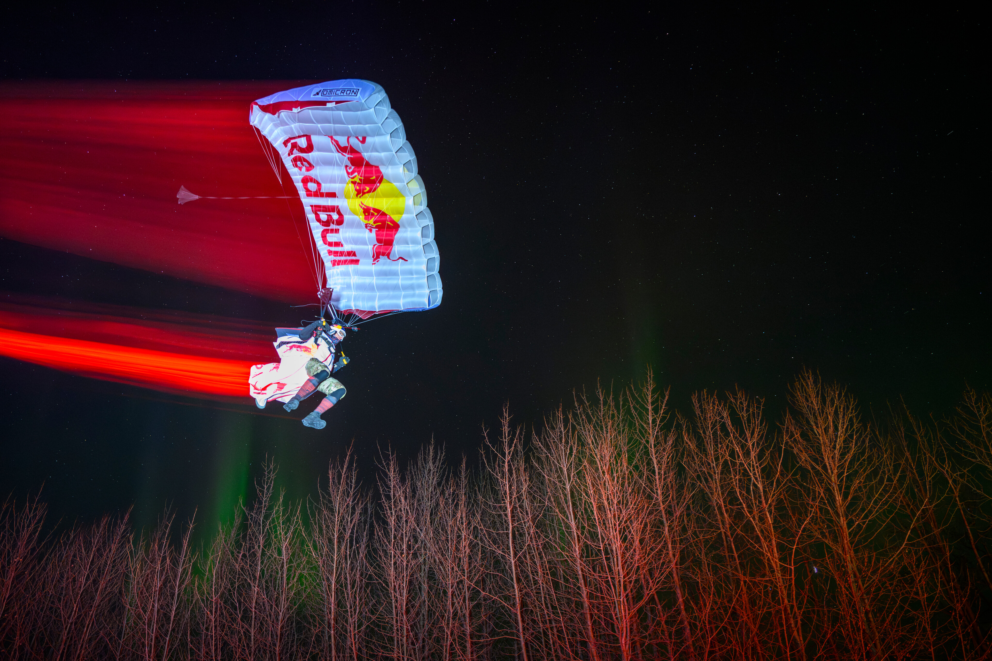 Jeff Provenzano wingsuit skydives under the Aurora Borealis near Palmer, Alaska, USA on March 23, 2026.