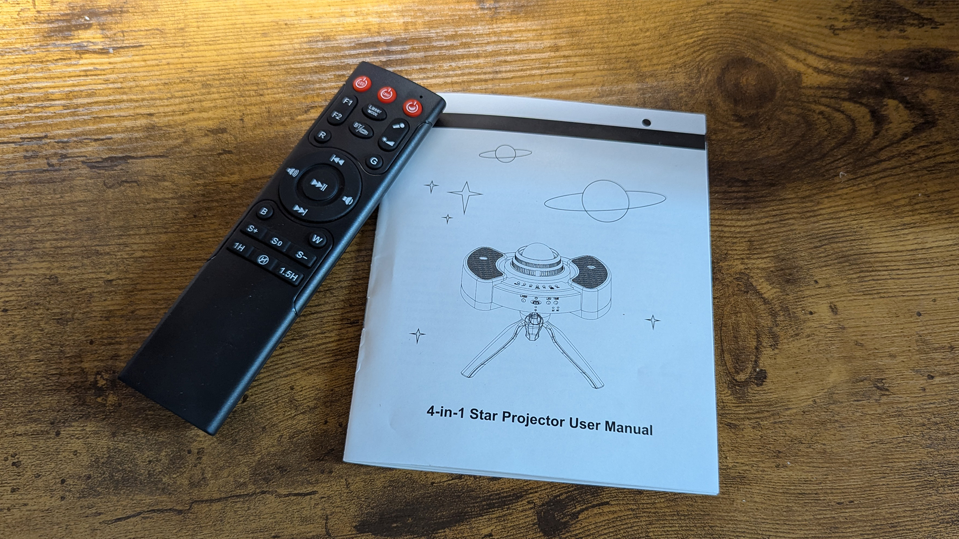 The YgiTK Northern Galaxy Lights Projector's remote control and instruction manual.