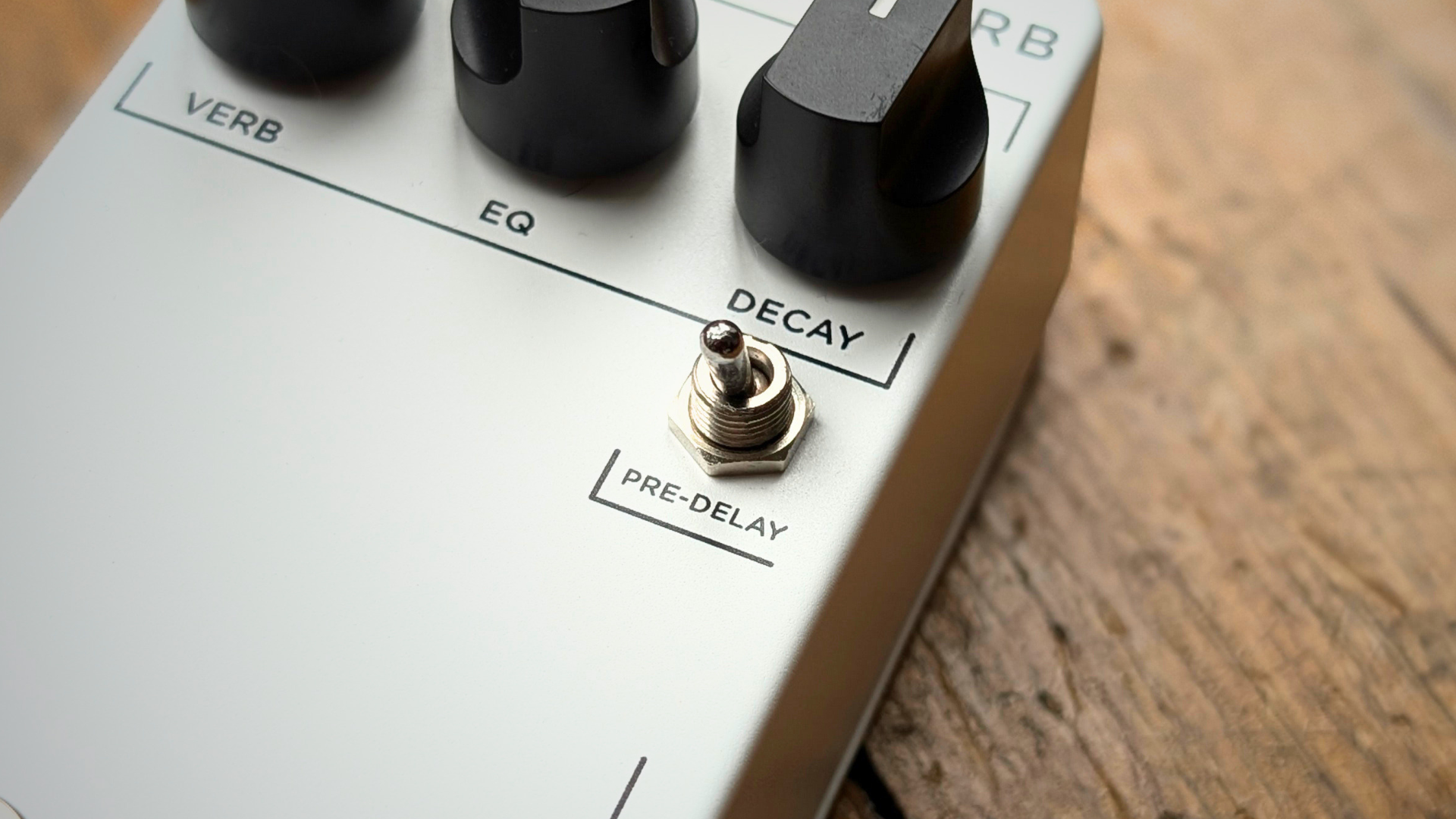 Close up of the pre-delay toggle switch on the JHS 3 Series Reverb pedal