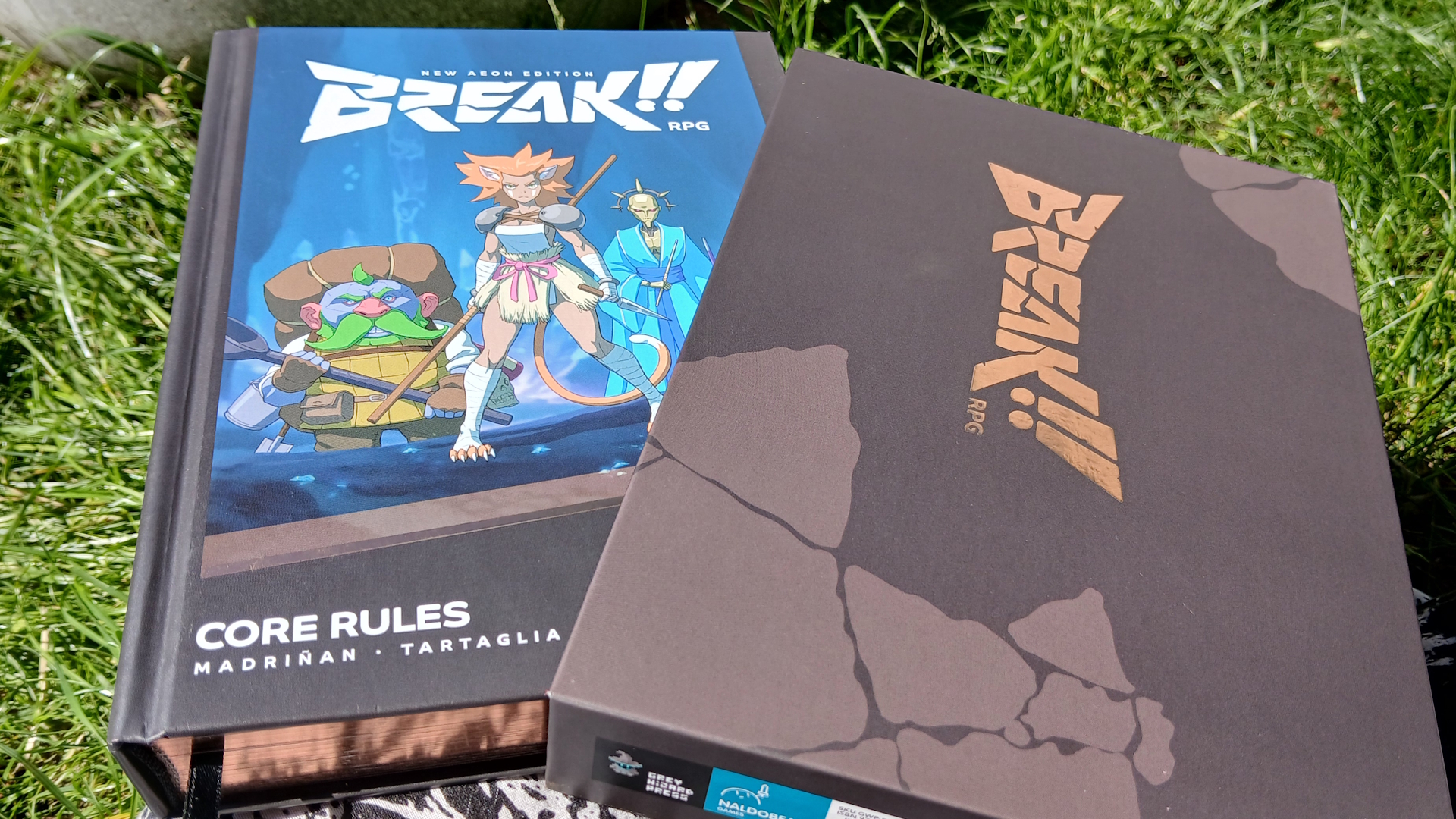 Break!! rulebook and box on a patch of grass