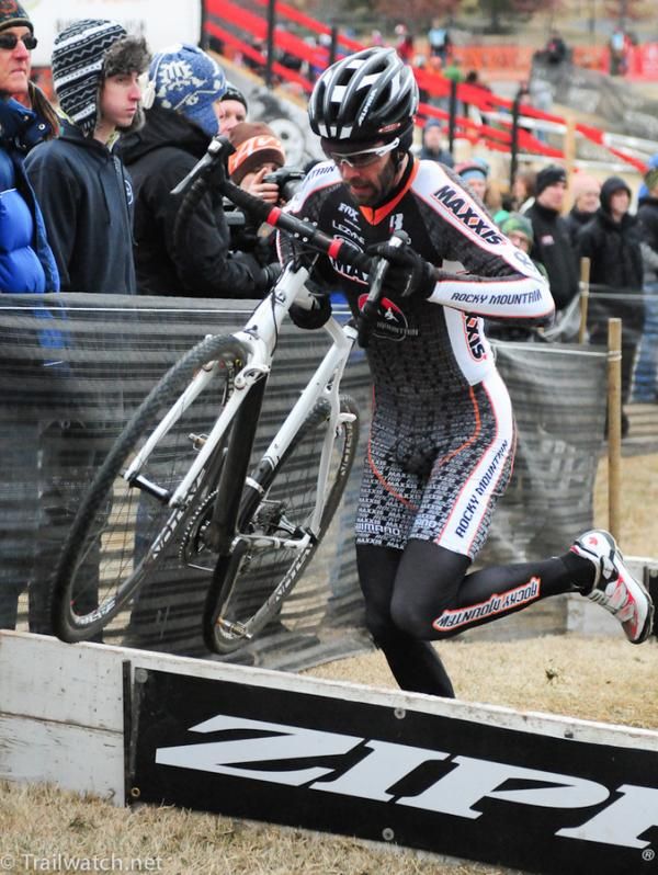 Geoff Kabush (Team Maxxis) over the barriers in first place