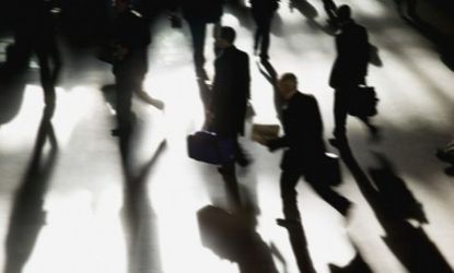 Commuters in Grand Central Station, New York: Job growth was better than expected in July and unemployment dropped slightly.